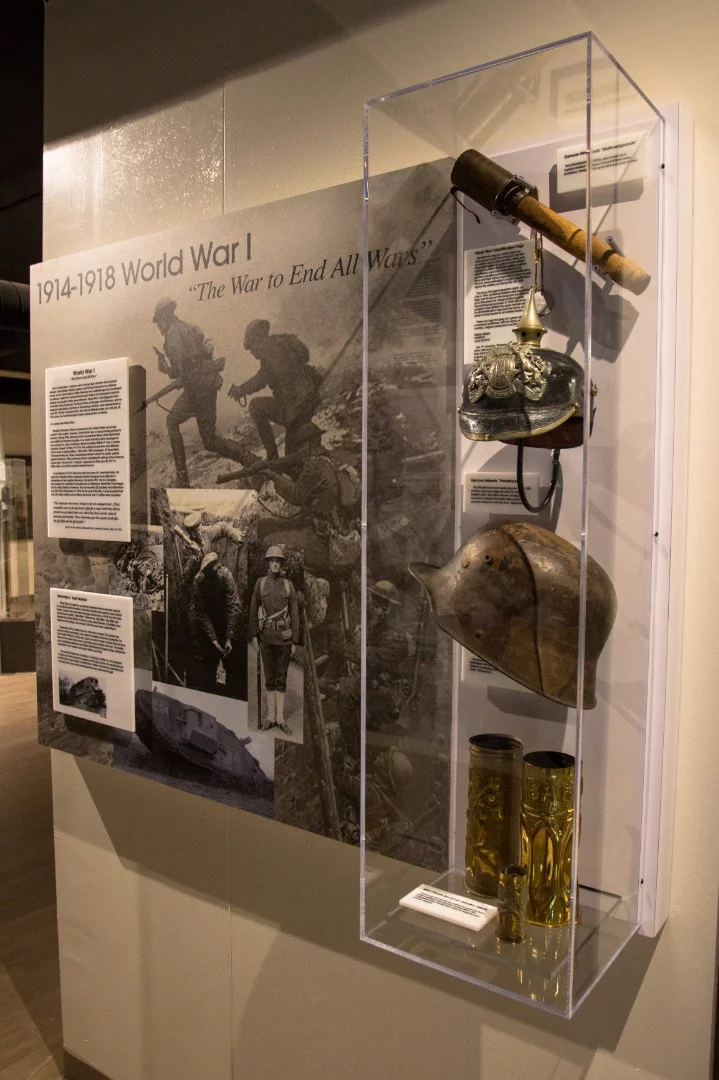 Among the many exhibits inside, you'll find memorabilia from World War I, II, the Korean War, and the Vietnam war. Pictured are German helmets, "Trench Art" (artwork made from bending and molding brass tank shell casings), and a Stielhandgranate (German hand grenade)