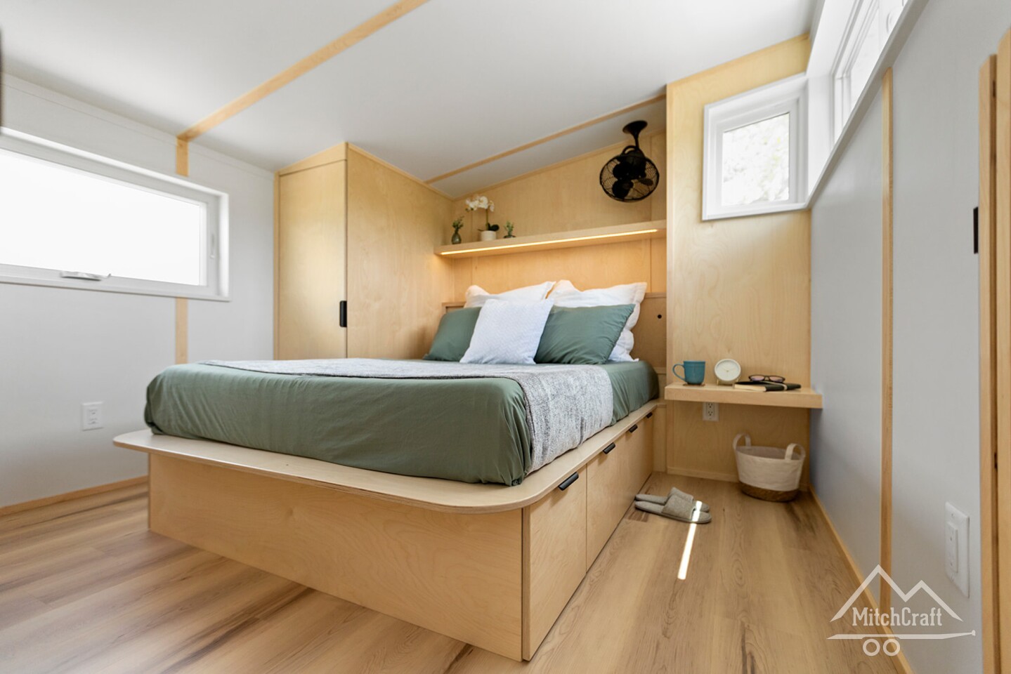 Casey's 32' x 10' Tiny Home includes a master bedroom with lots of storage space and headroom to stand upright