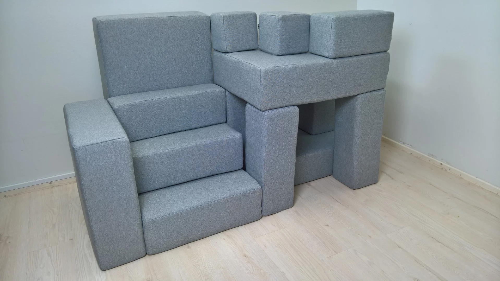 Dubbed BiT, the series of upholstered sofa shapes and pieces easily join together using magnets