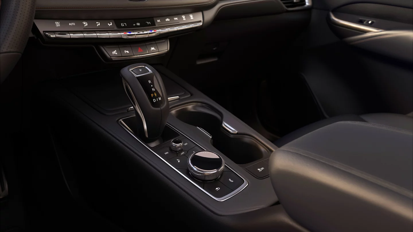 The large rotary controller (pictured) controls various media and vehicle functions for the 8-inch infotainment system and is a first for Cadillac