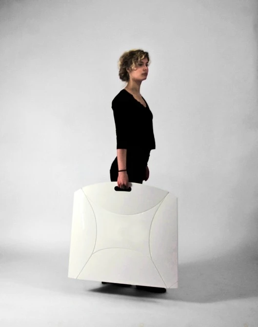 The Flux chair folds down flat to look more like an artist's folio than a designer seat