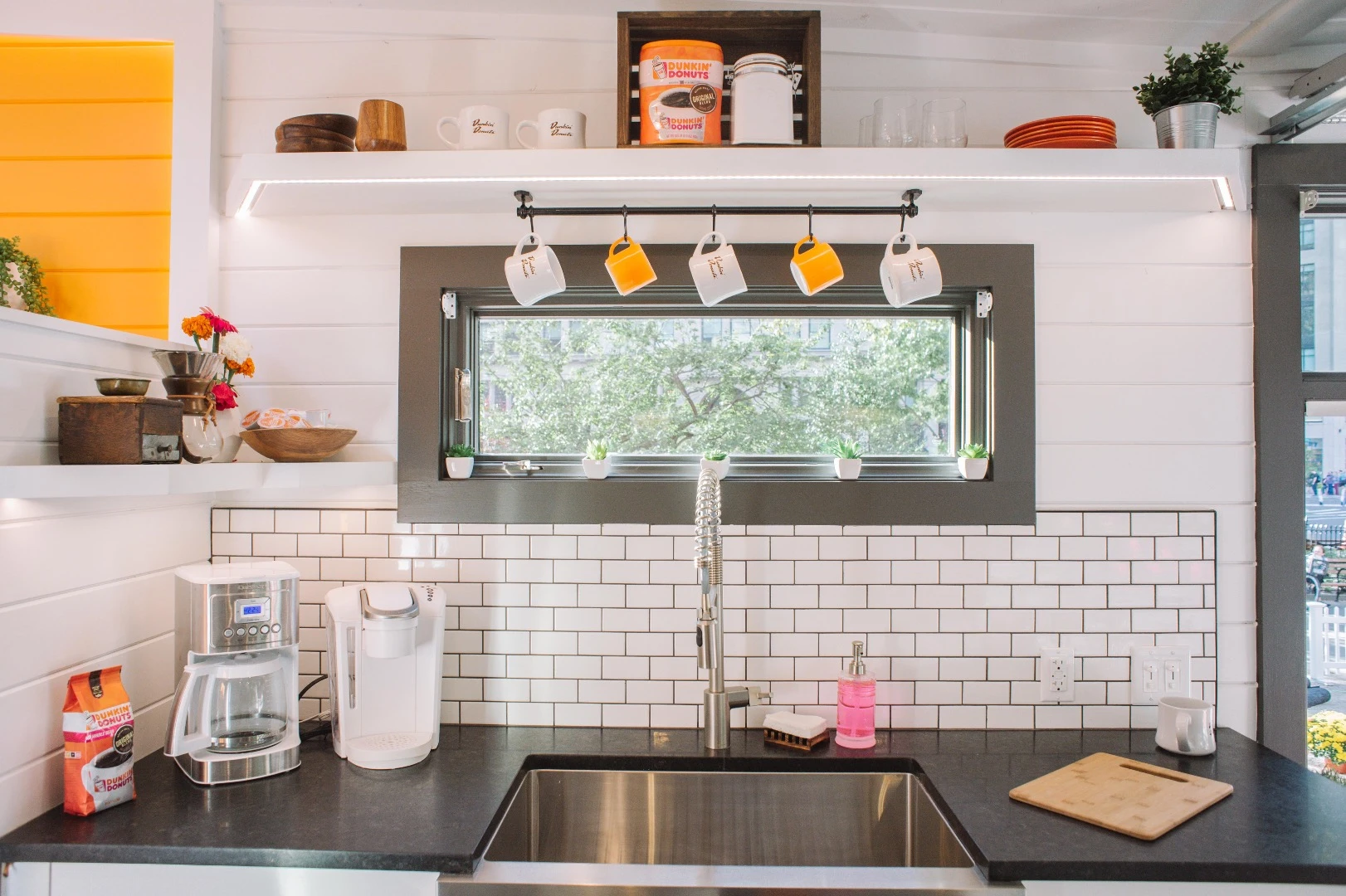 The Home That Runs on Dunkin's kitchen is large for a tiny house and includes full-size appliances