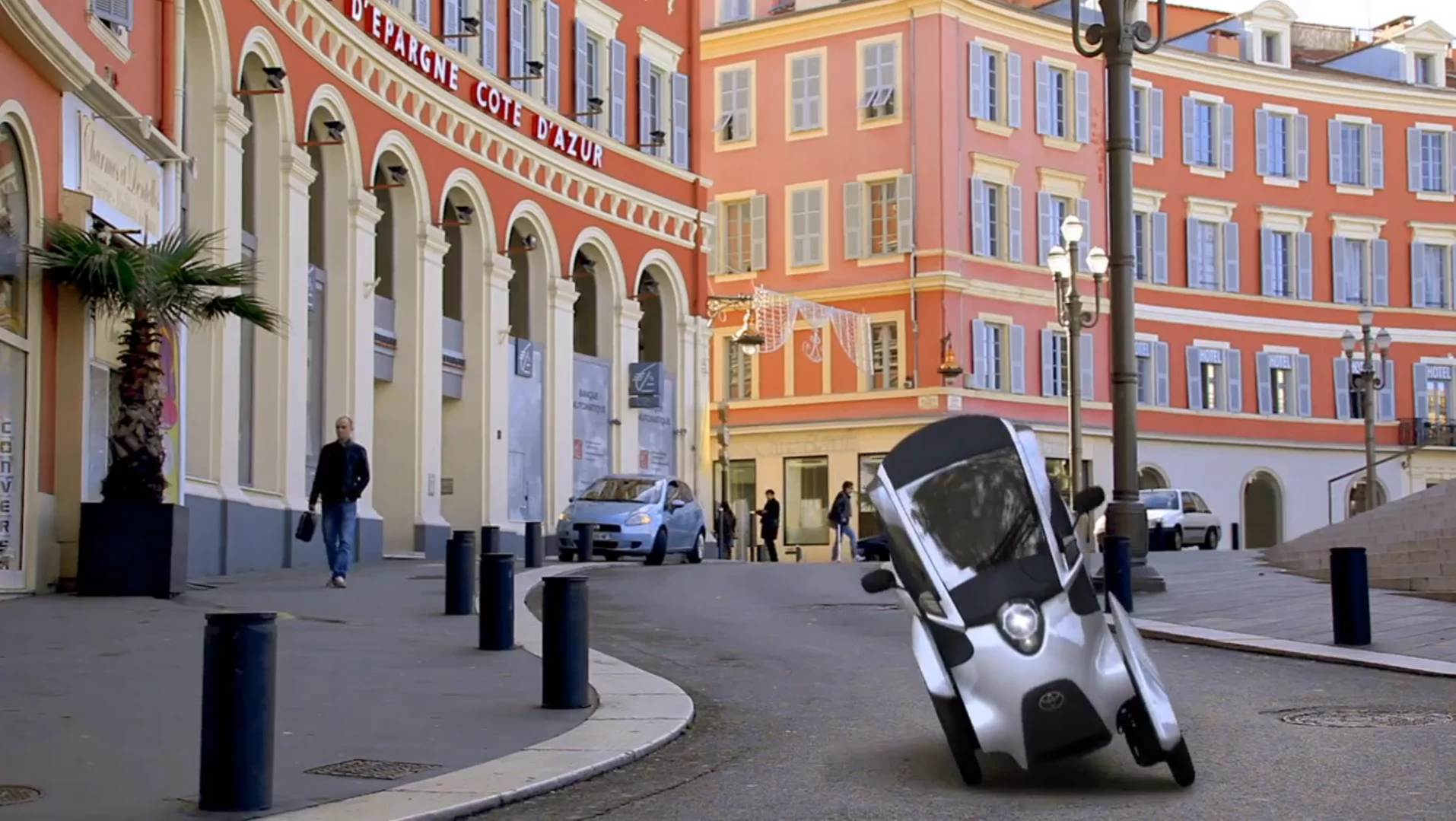 Toyota's i-ROAD is a fully-enclosed, two-seater, three-wheeled, fully-electric, Personal Mobility Vehicle (PMV)