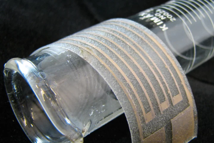 The particle-free silver ink is here applied to a thin, stretchy plastic film to make a flexible silver electrode