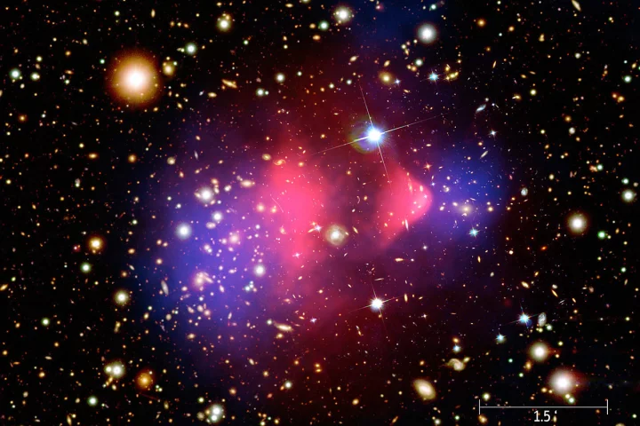 A composite image showing galaxies in optical light, X-ray emissions in pink and invisible mass – or dark matter – in blue
