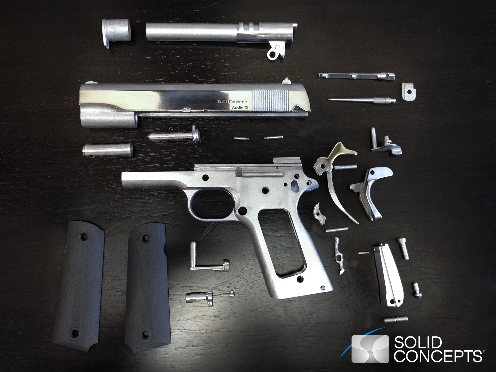 The disassembled Model 1911 45ACP showing its 3D-printed parts (Image: Solid Concepts)