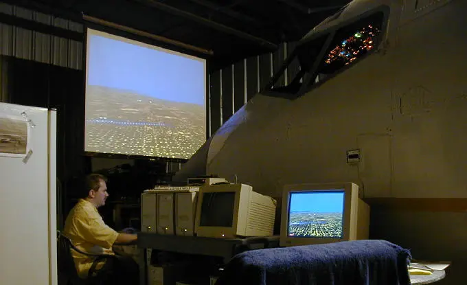A projector screen in front of the nose plays the flight simulations