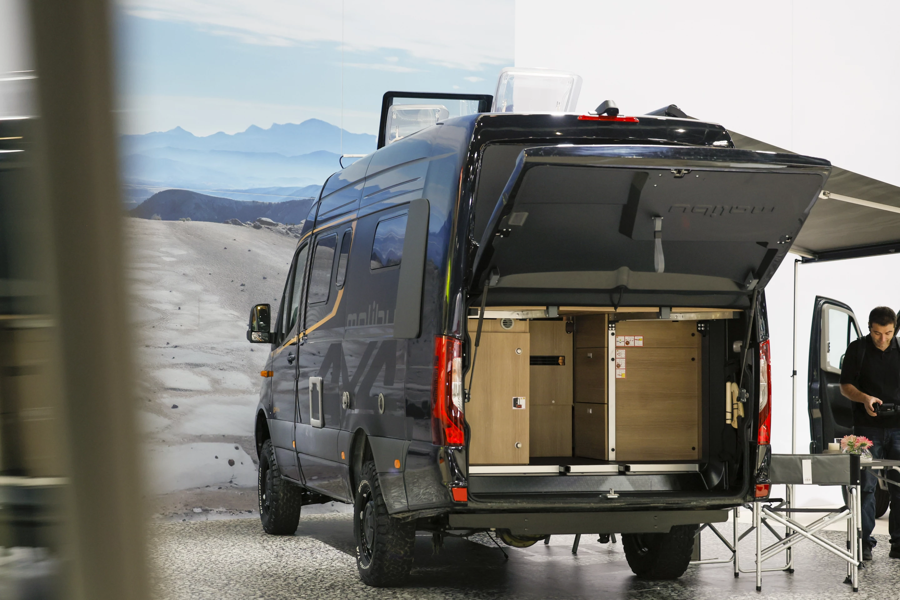 The unique flap is the main hint that the Malibu Genius camper van is a little different than the typical Mercedes-Benz Sprinter camper