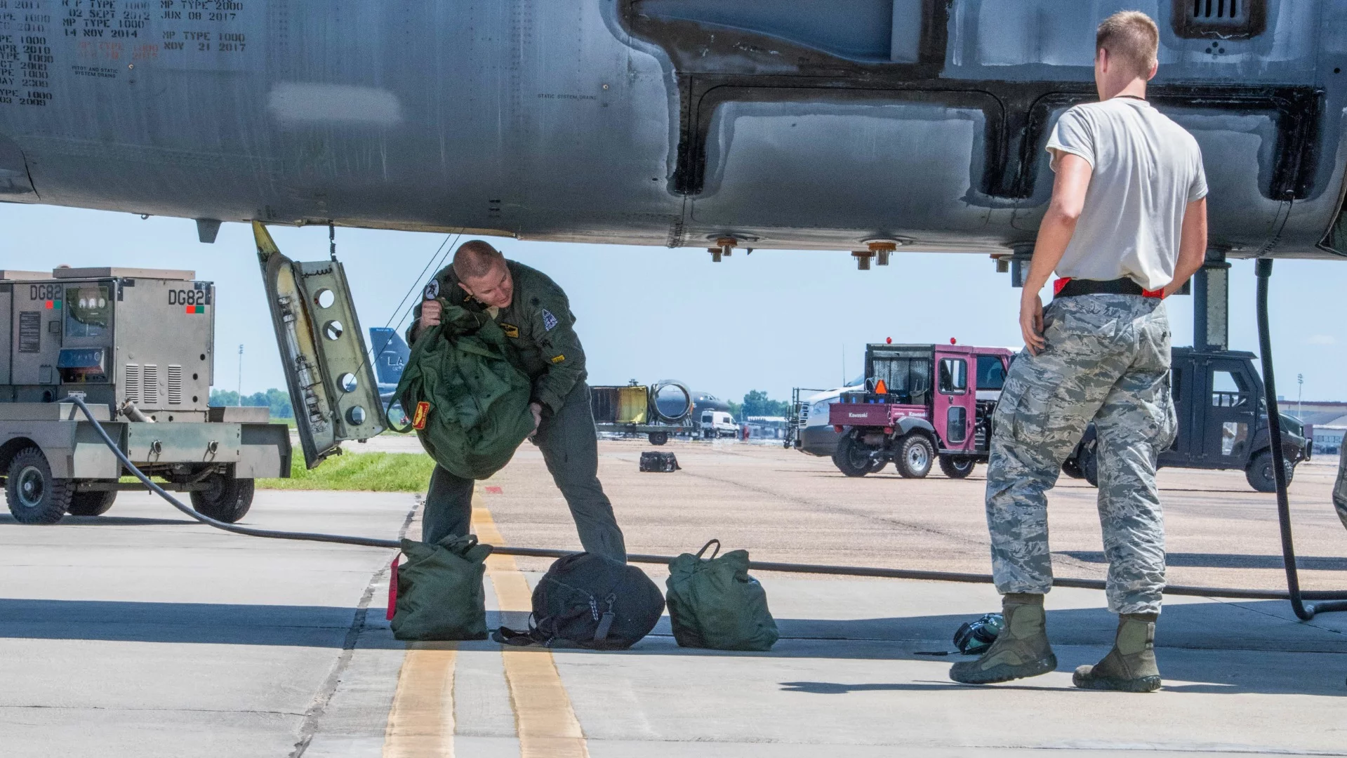 Lieutenant Colonel Eric Barkley, an 11th Bomb Squadron weapons system officer, unloads, “Wise Guy,” a B-52 Stratofortress after flying into Barksdale Air Force Base