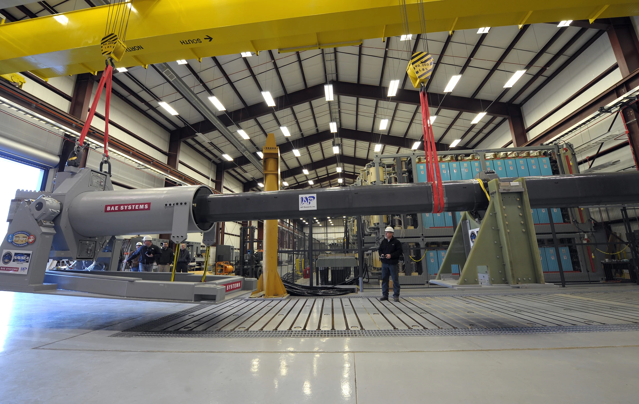 A 32-MJ version of the Office of Naval Research-funded Electromagnetic Railgun (EMRG) prototype is maneuvered into place for government evaluation (Photo: U.S. Navy photo by John F. Williams)