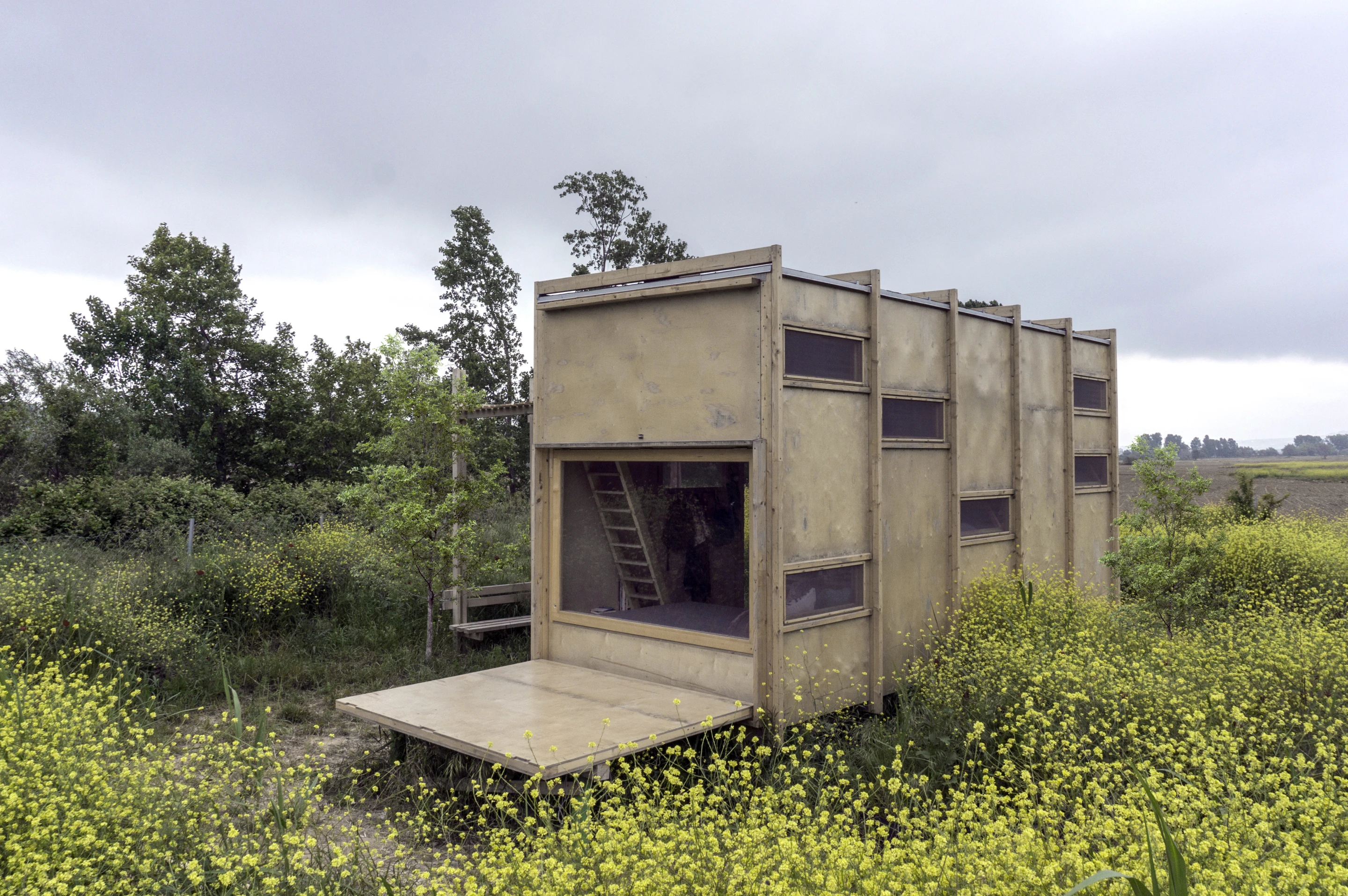 The aptly-named Cabin on the Border opens up to the outside with a large operable wall and window