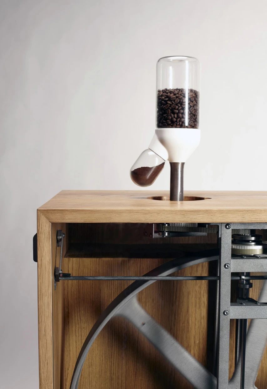 The coffee grinder driven by flywheel power