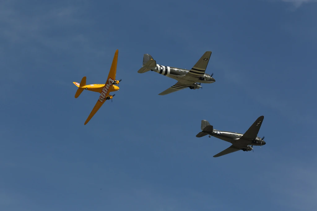The Douglas DC-3s marks its 75th Anniversary this year and the largest formation assembled in decades arrived at Oshkosh on Monday to celebrate the occasion (EAA photo/Amy Gesch)