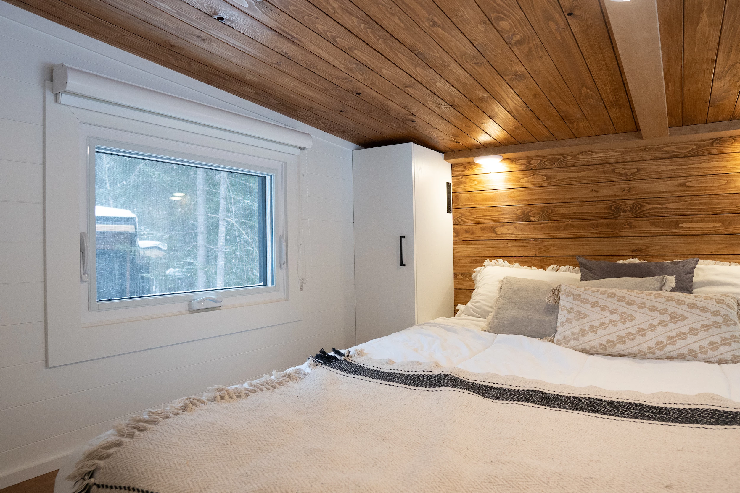 The Nomad 5th Wheel's bedroom includes storage closets