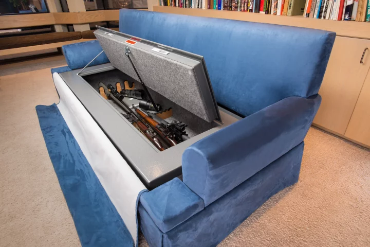 Besides offering a comfy place to sit and watch TV, the CouchBunker conceals a large gun safe and provides some handheld shields in the form of bullet-resistant cushions