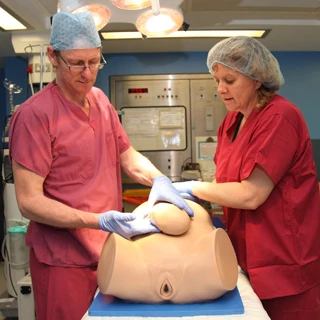 Adam,Rouilly developed Desperate Debra in collaboration with the UK National Health Service and Guy's and St Thomas' Hospital in London