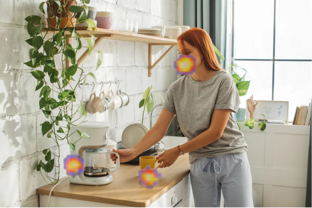 Where are the noises coming from in this picture? According to the SoundCam Go, from the coffeemaker, the mug, and her mouth