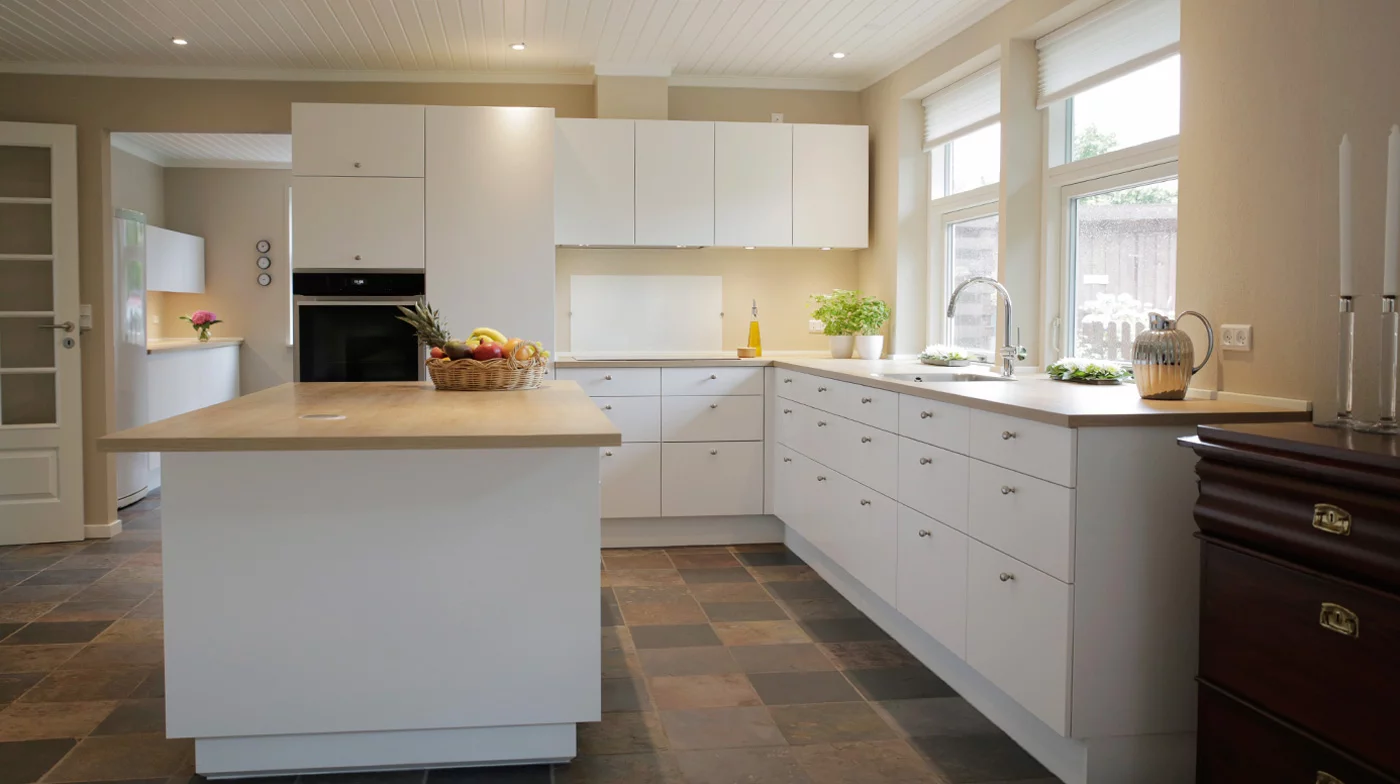 Concertina plinthing around the bottom of the kitchen units is used to maintain their aesthetic