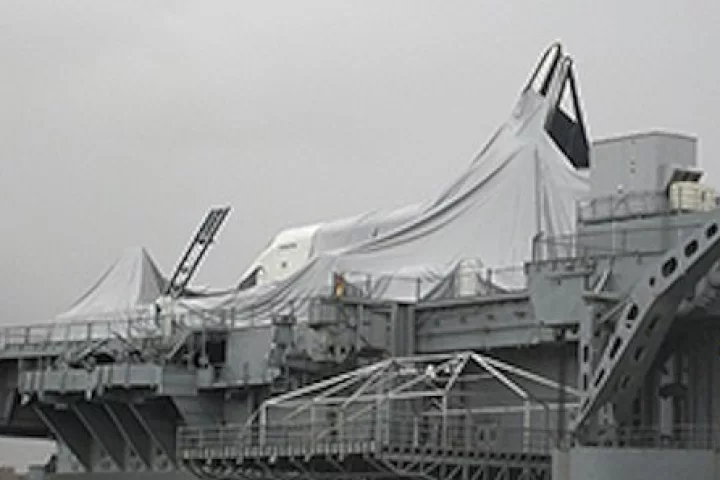 Space shuttle Enterprise after Hurricane Sandy passed – the inflated display pavilion has collapsed, and a piece of the Enterprise's tail is missing (Photo: Denise Chow)