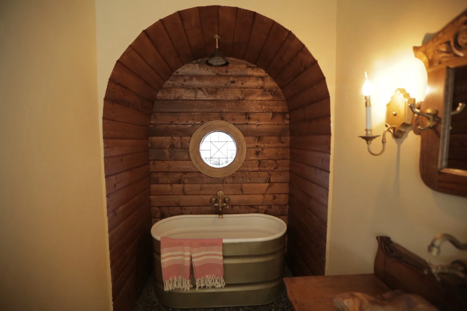 A grey water system filters and redistributes waste from the shower/bath and sink to water the grass