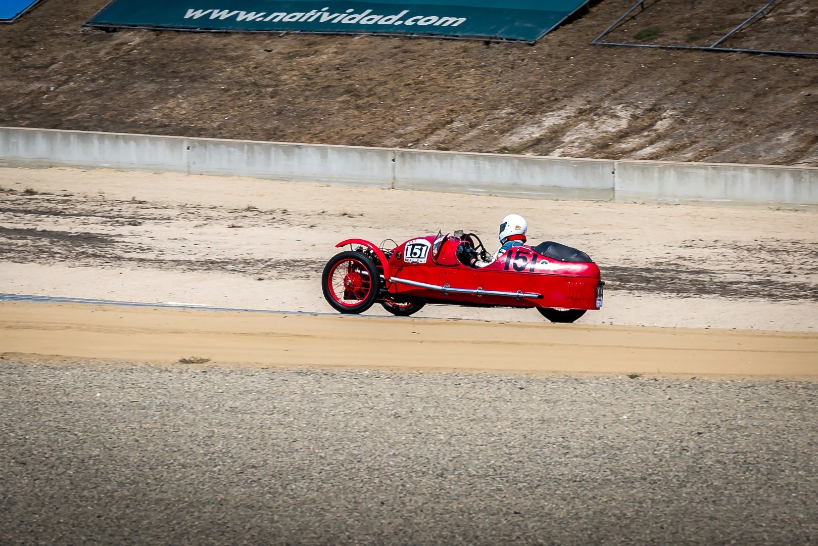 A Morgan 3-wheeler making its way out of Turn 10