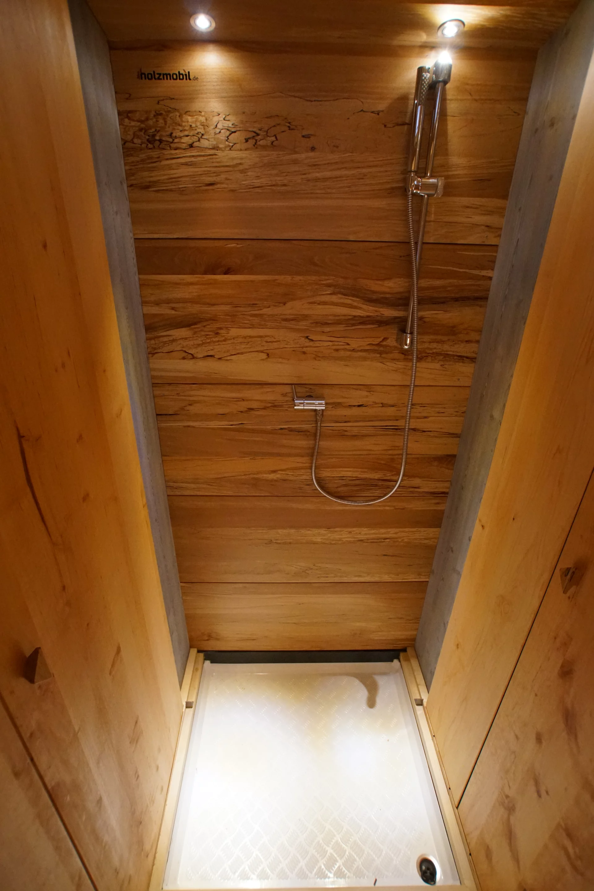 Wood floor panel removed for showering