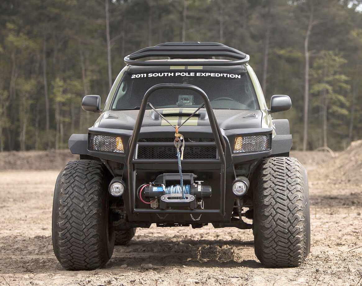 The 2010 Toyota Tacoma Polar Expedition as it will be auctioned is decked out in a NATO Green vinyl wrap over a Graphite interior with 14,281 miles on the odometer