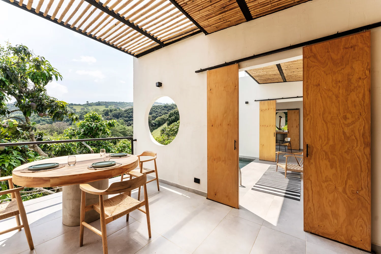 Sliding timber doors and circular cut outs, allow for flow of air throughout the entire home