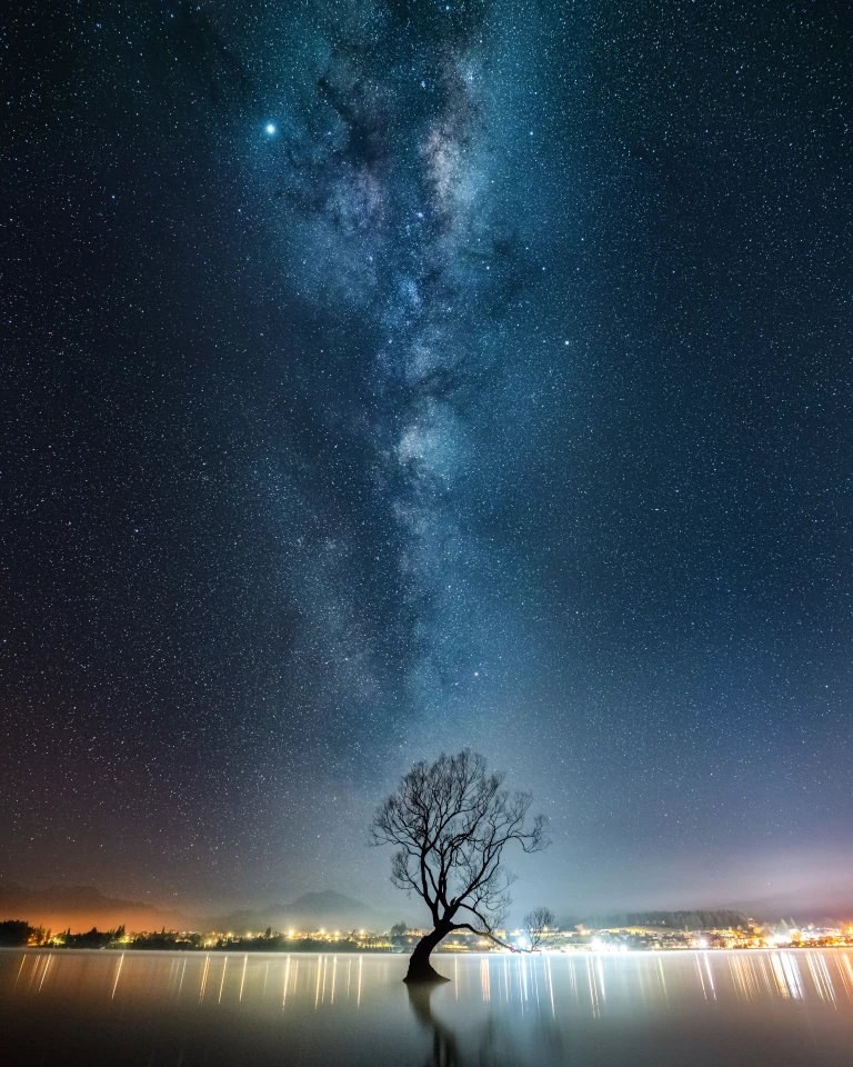 Astro division finalist: Milky Way over the Wanaka TreeWhen I arrived at this location near midnight, I was the only one there. It was quite a contrast compared to the normal flow of photographers during the day. I stacked together 15 images, each one being a 4 second exposure. Camera: Alpha 7R III Lens: FE 16-35mm F2.8 GM Focal length: 16mm Shutter speed: 4s Aperture: ƒ/4 ISO: 12800