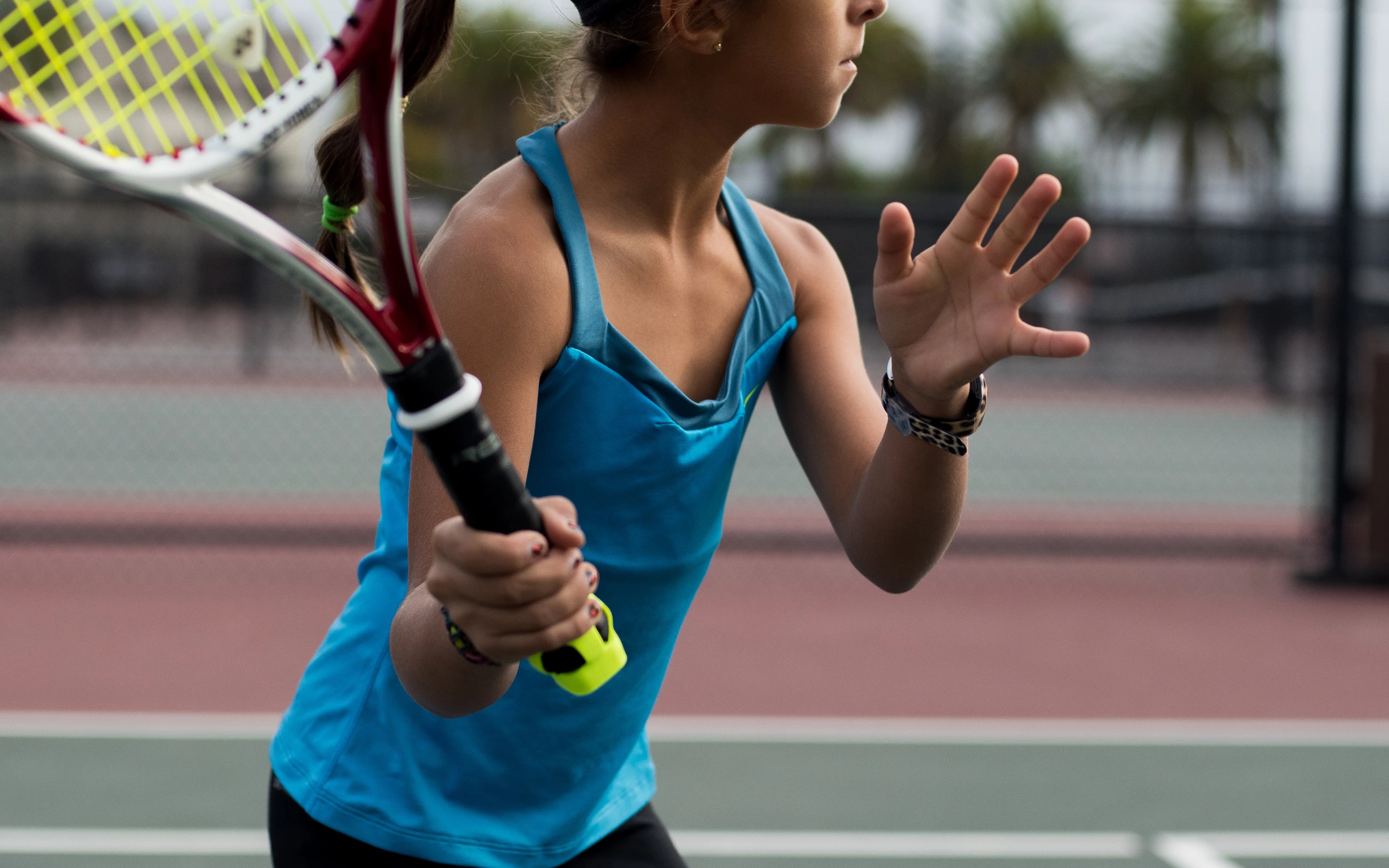 The Zepp Tennis sensor attaches to the racket handle