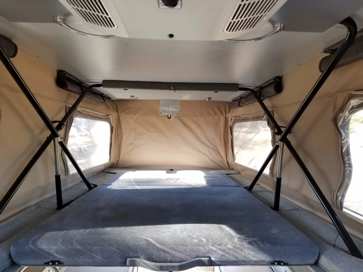 The CV1 sleeps four adults on its roof and cabin beds