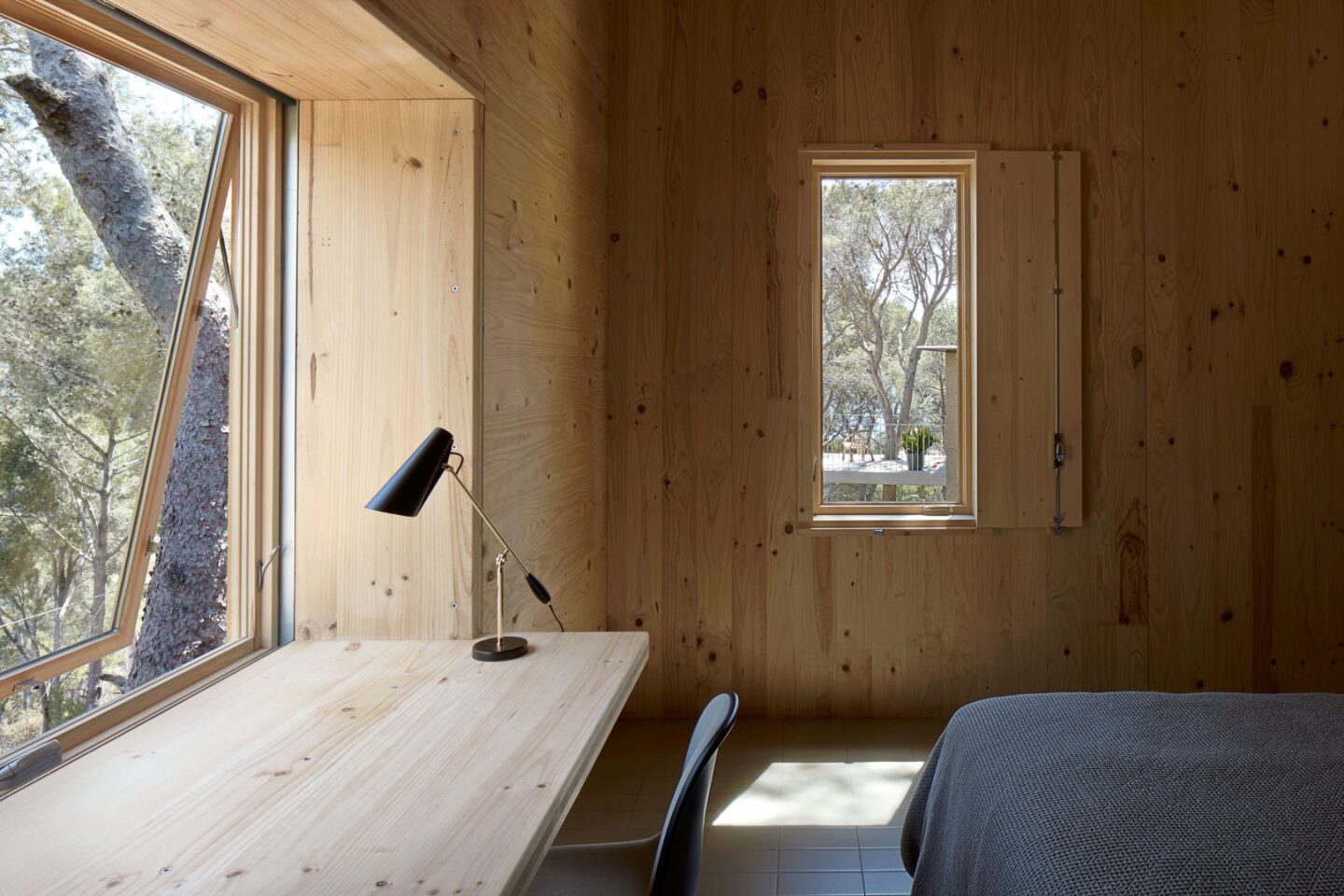 Where possible the homes also boast built-in timber furniture, including this desk in the bedroom