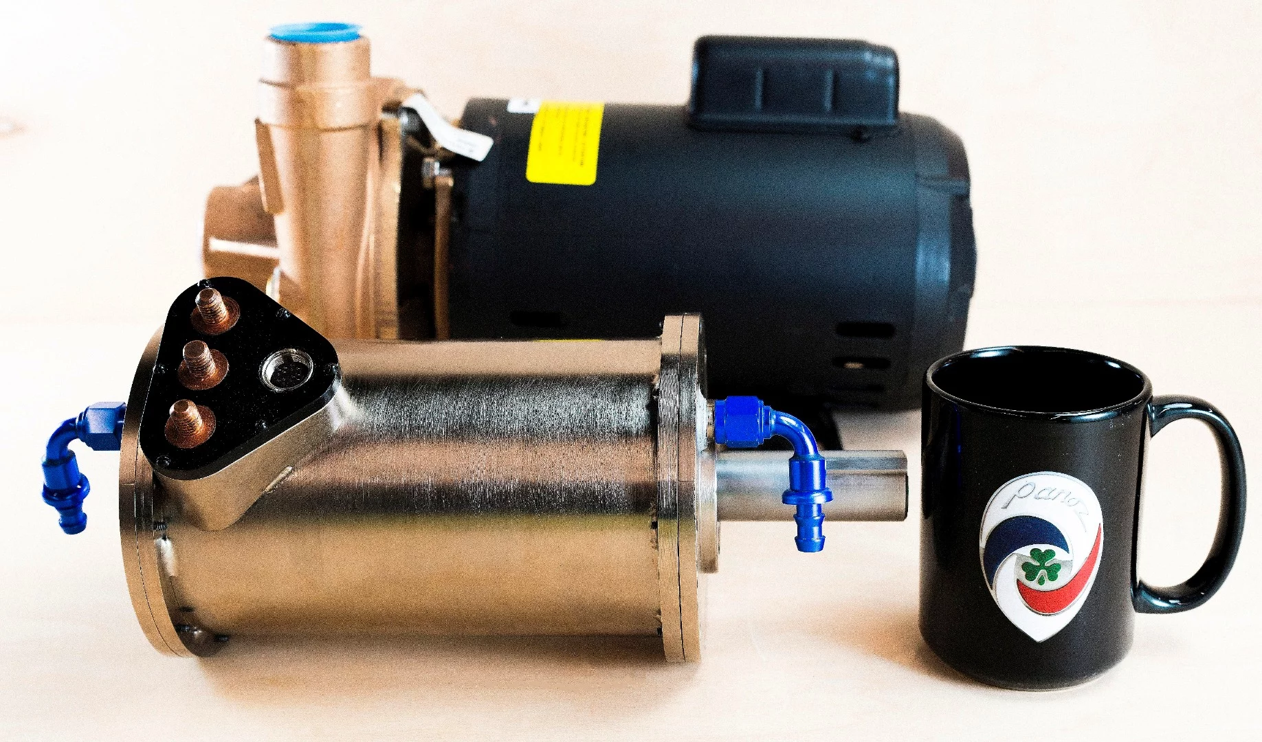 The DHX Falcon, at front, produces 80 hp and is equivalent to the typical automotive electric motor shown behind, yet is 75 percent less bulky