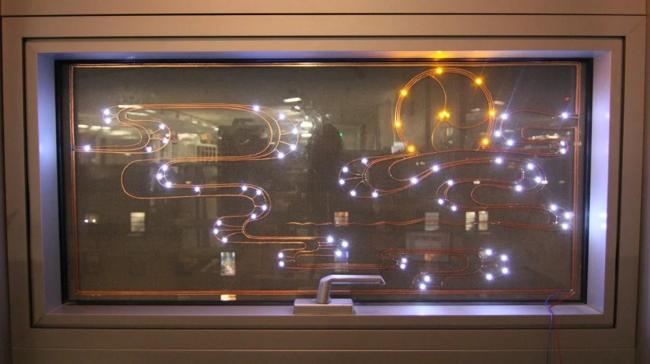 Chibitronic elements on a window lit up at night