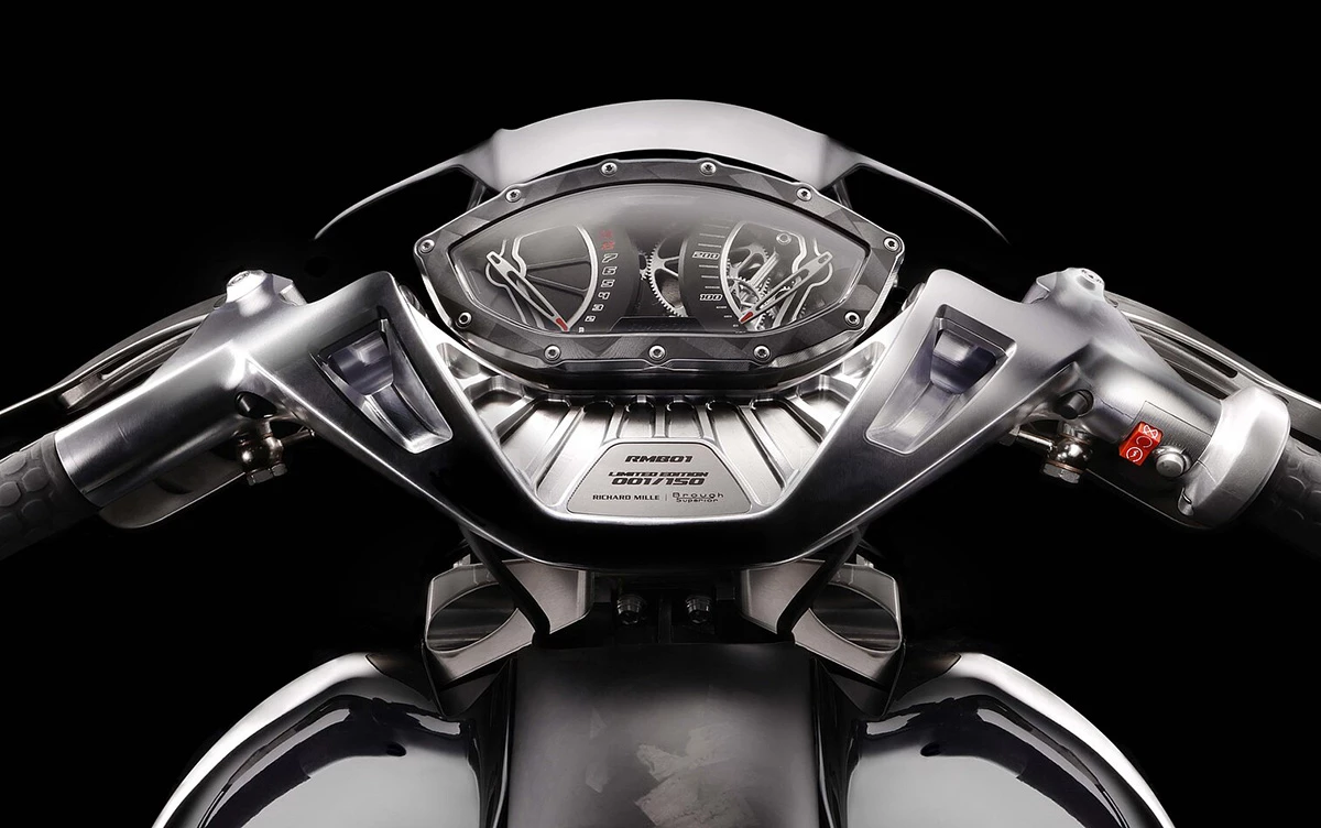The gauge cluster is designed to mimic Richard Mille watches with their oversized cases, visible screws, and skeletonized dials