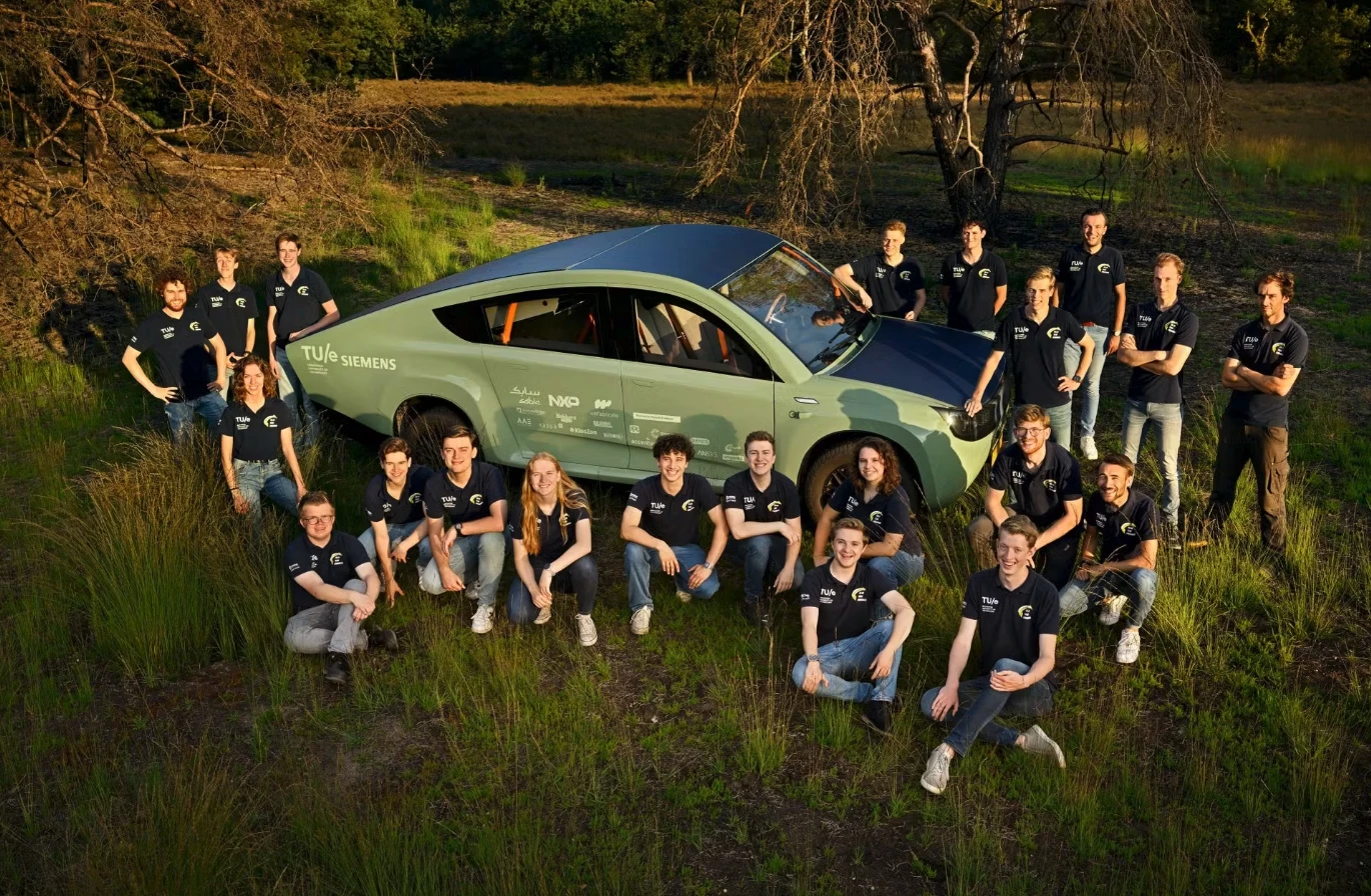 Solar Team Eindhoven poses with its 2023 creation, the Stella Terra solar off-road car