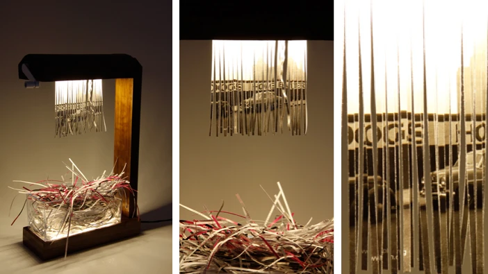 Eliminator by Merve Kahraman is a table lamp that uses the hanging curtain of shredded paper as a design feature
