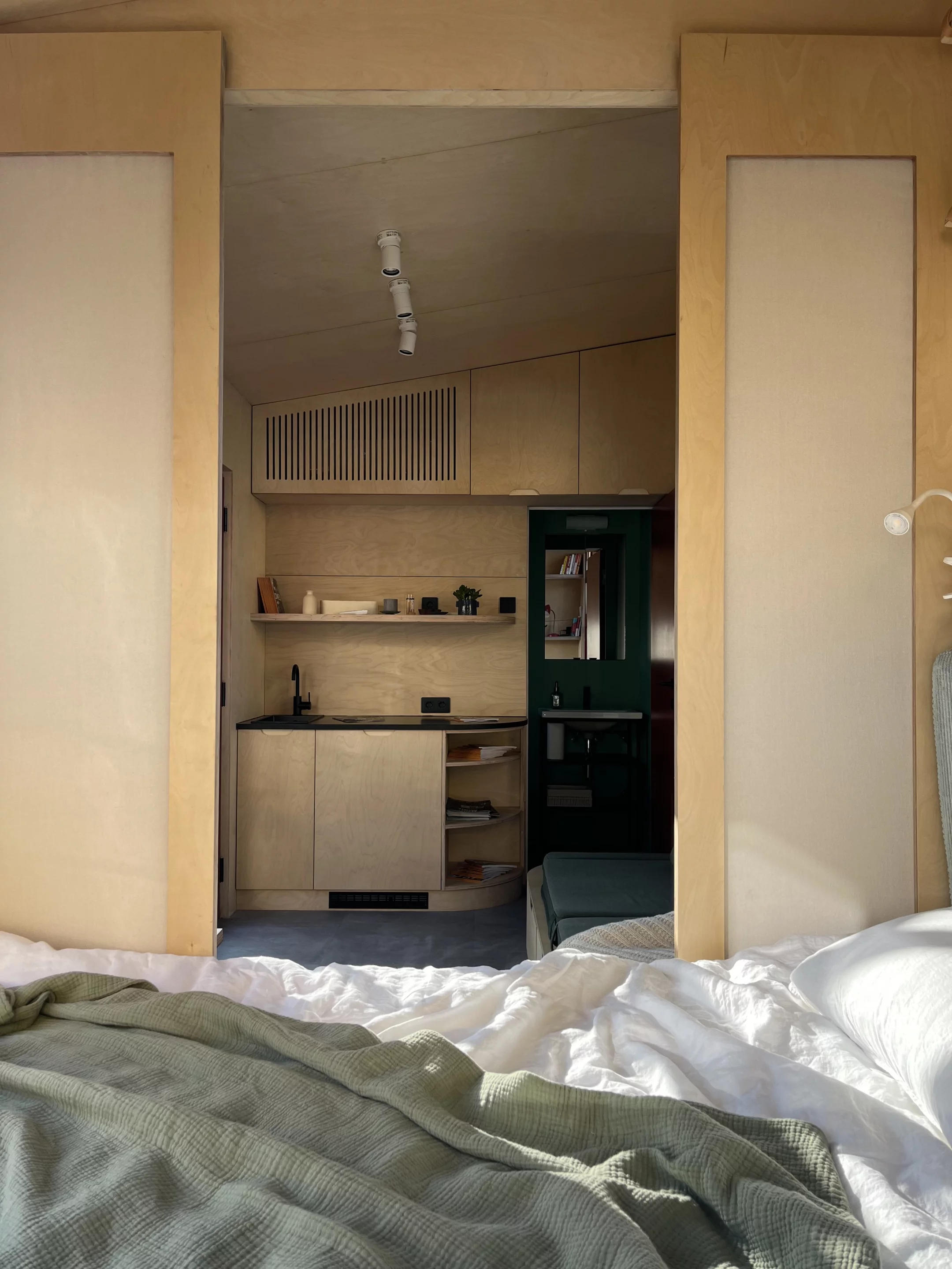 The THOW's bedroom is accessed by sliding door