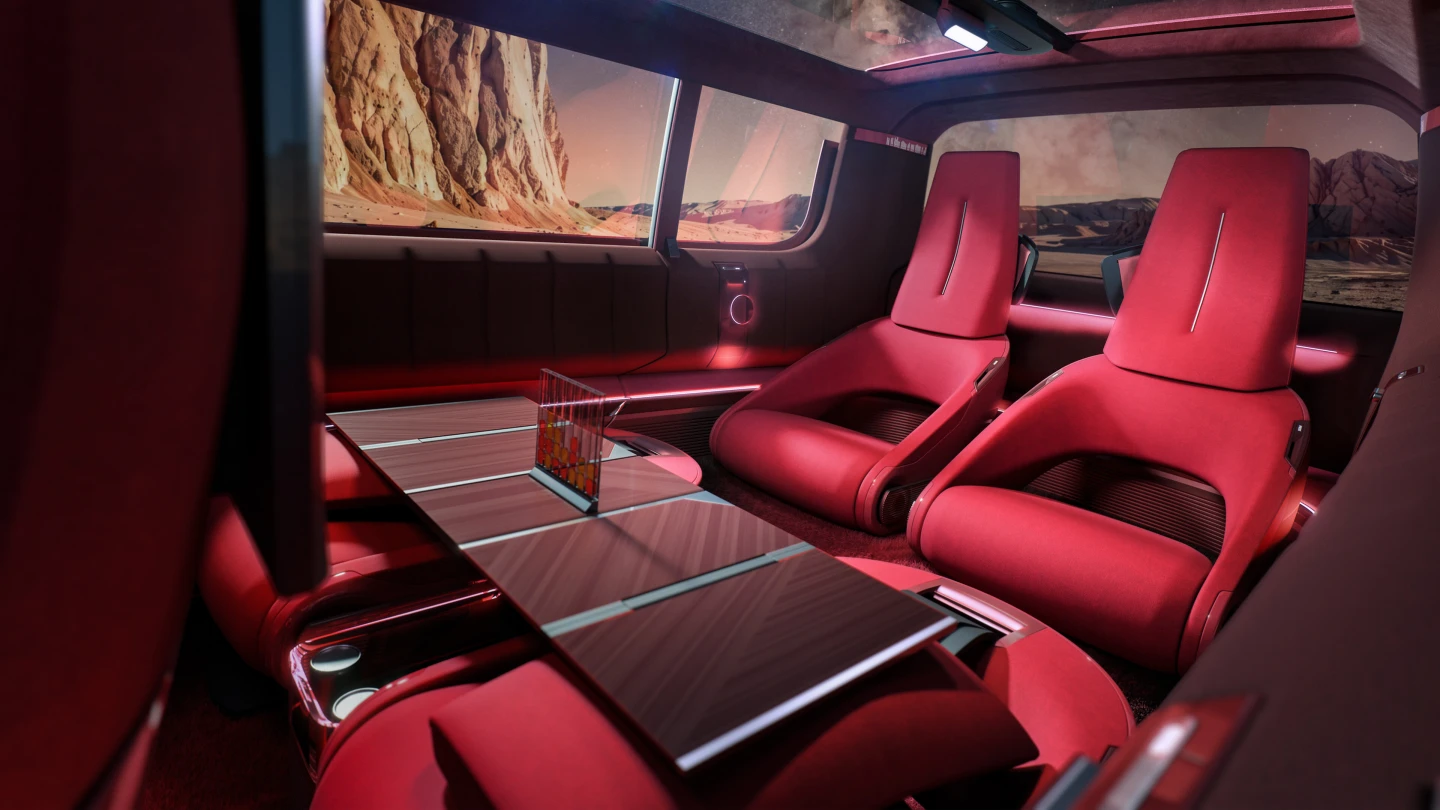 "In the four-seat configuration, the two seats in row 2 fold down completely to form a large table available to the passengers in row 3"