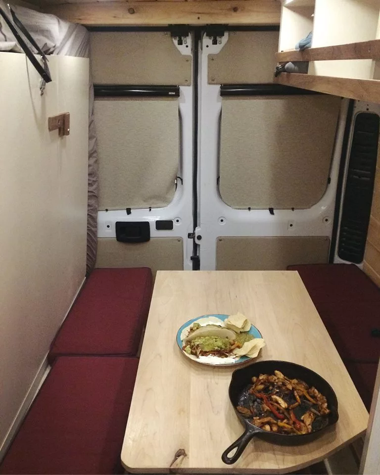 Notice the Murphy bed against the looker's left wall. Off Grid says it takes under a minute to move the table out of the way and drop the bed for sleep configuration. Or they can work with the customer on installing a lowering table