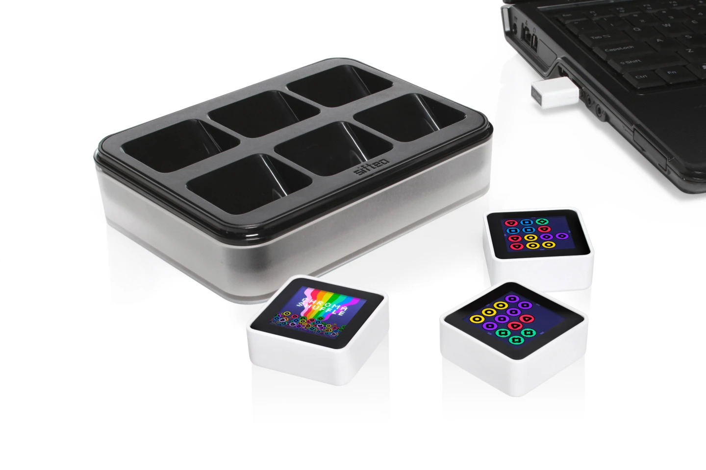 Each Sifteo Pack will contain three cubes, a charging hub sporting places for six cubes, and a USB radio link