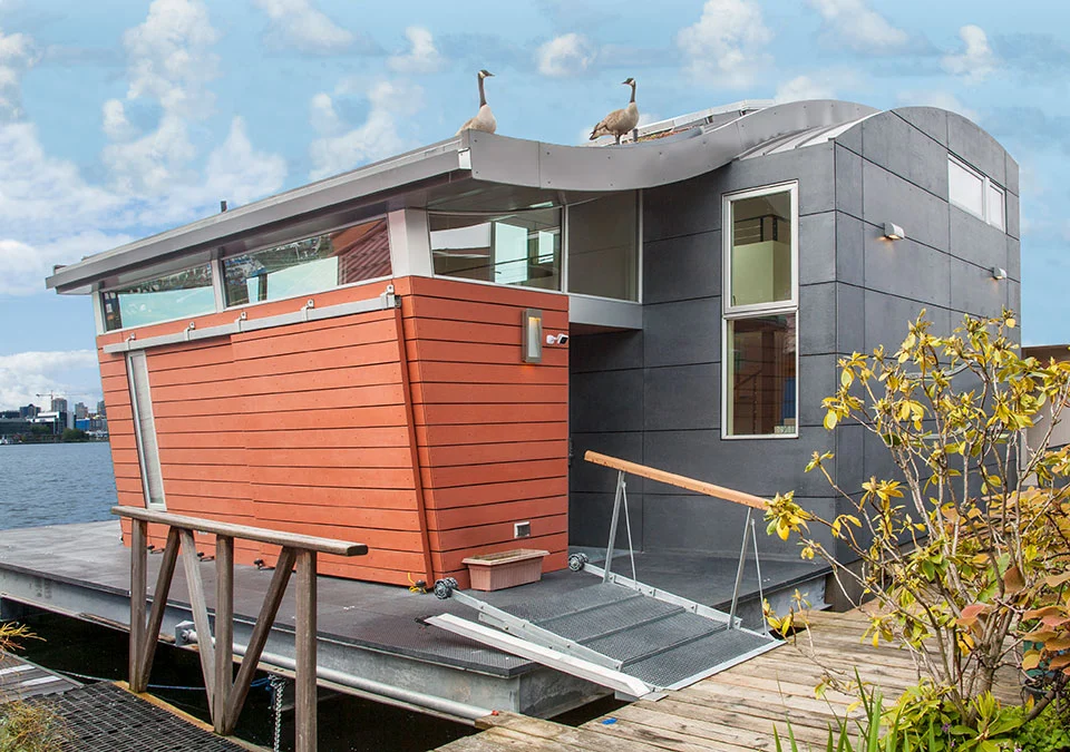 Houseboat H features both a roof-based solar array and a green roof section
