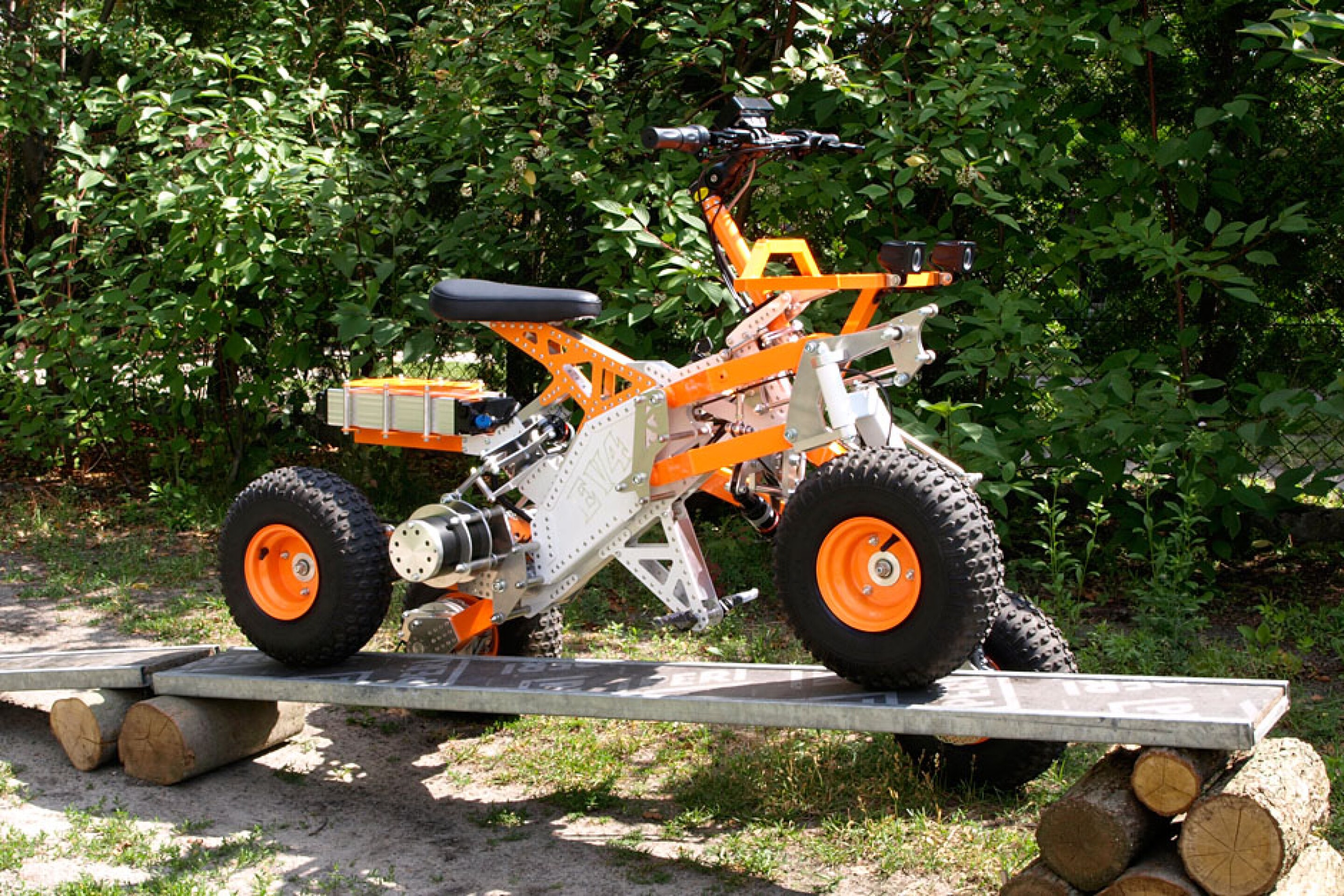 Tilting electric quad gets menacing offroad big brother