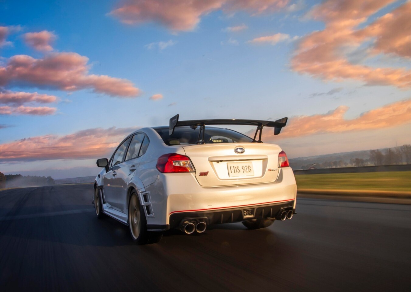 The larger wheels allow more aggressive Brembo brakes with cross-drilled steel rotors and 6-piston monoblock calipers (front, 2-piston at rear)