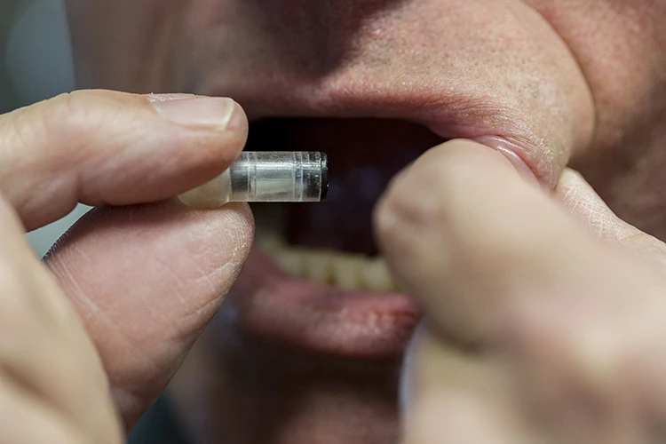 The MucoJet is a pill-like device that could painlessly deliver vaccines and drugs through the inside of a patient's cheek
