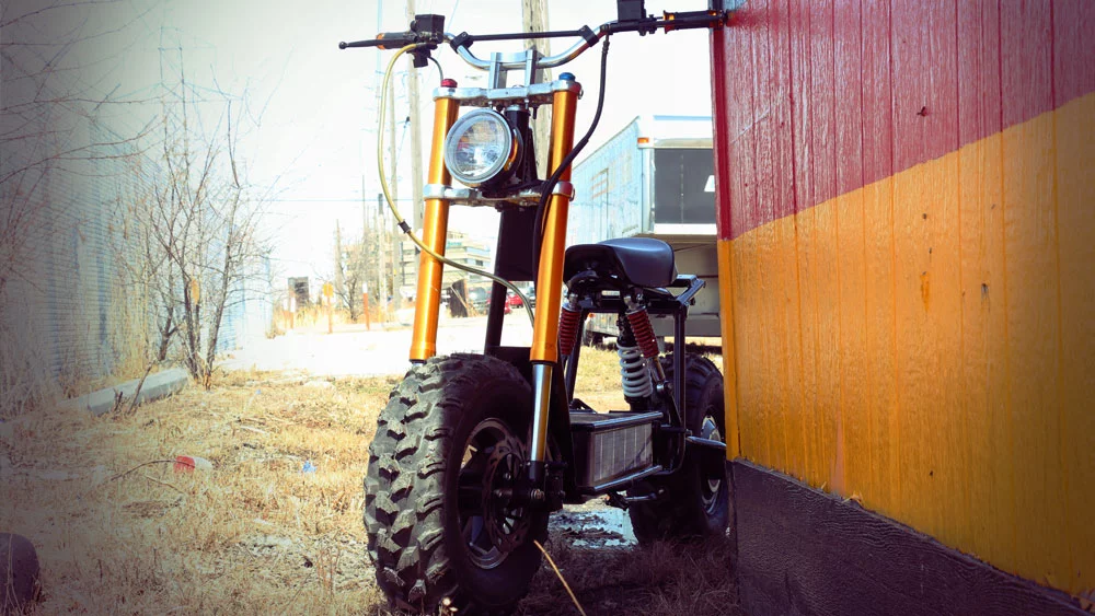 Inverted suspension forks hold the first of the 10-inch alloy rims and bear a 4500 lumen LED headlight on the front