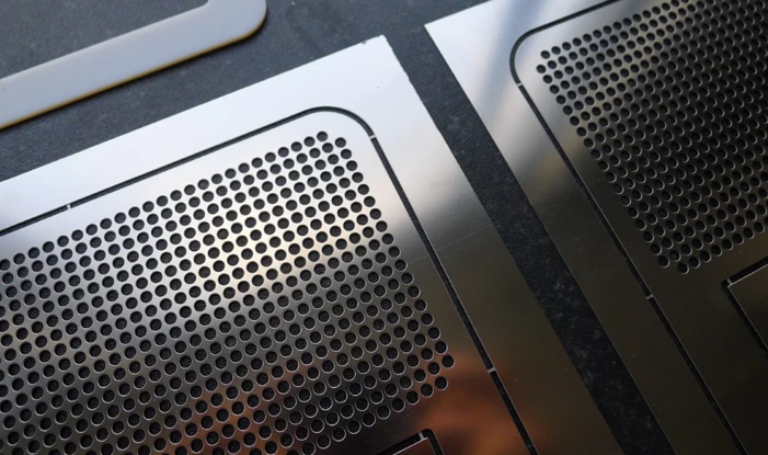 The idea is that the flat boombox could be shipped in an envelope and then bent into shape by the user using lines scored on the flat sheet