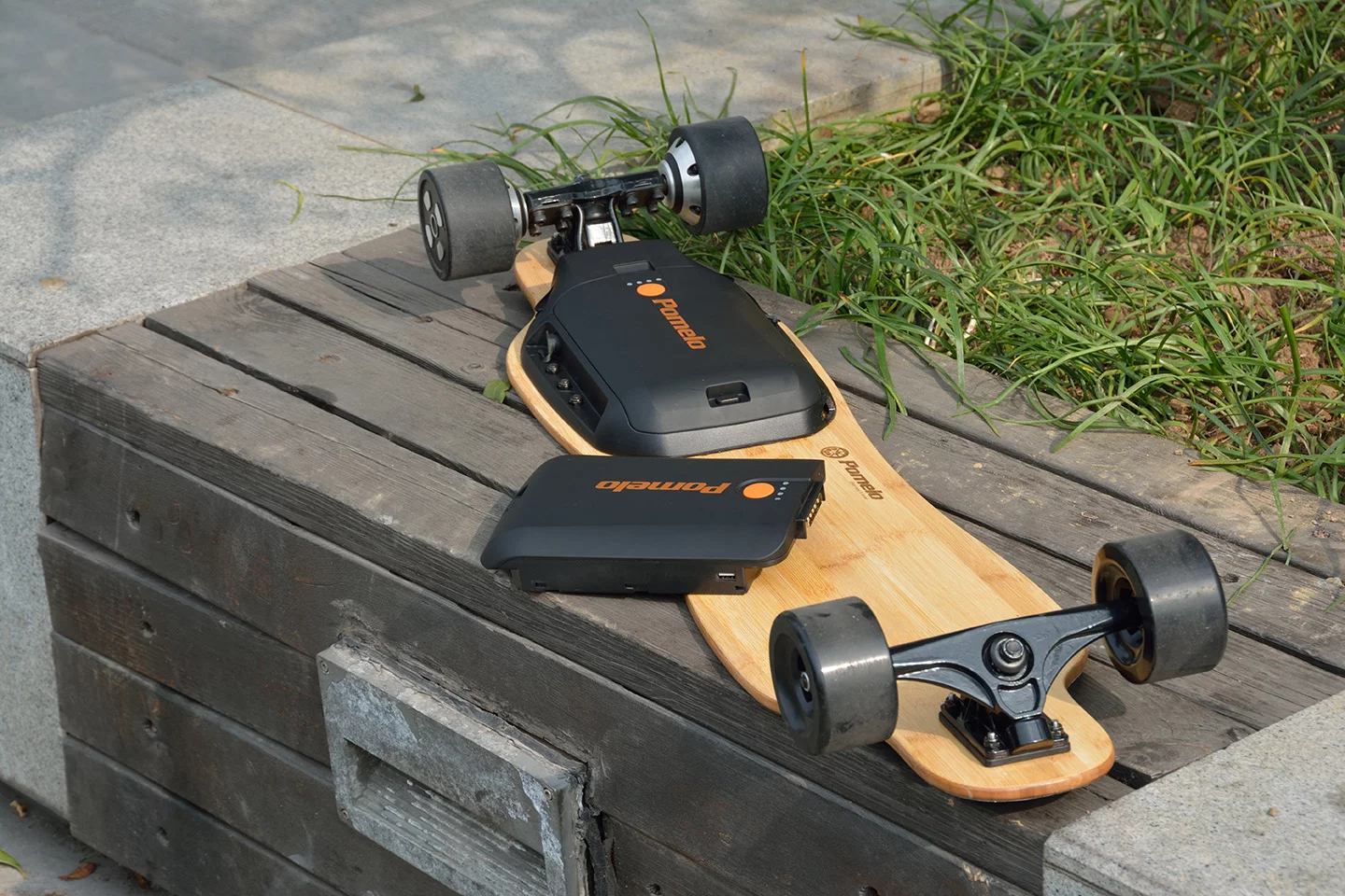 The Pomelo Pro electric longboard's 5,700 mAh battery can be hot-swapped for even more electric range per trip