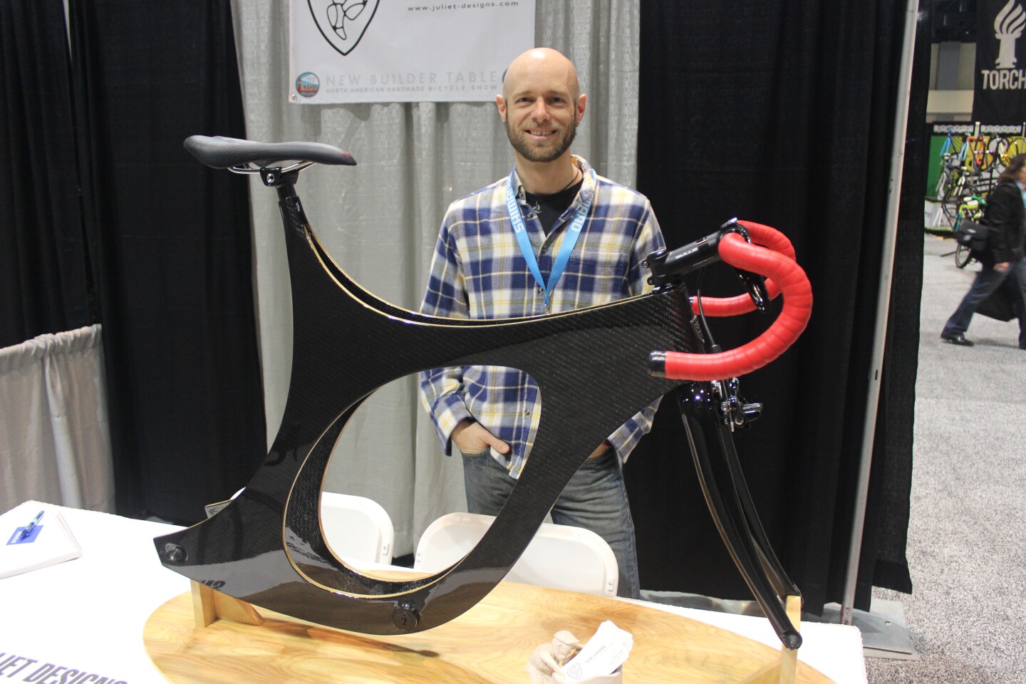 Ryan Cargo with his wood/carbon frame, at NAHBS 2018