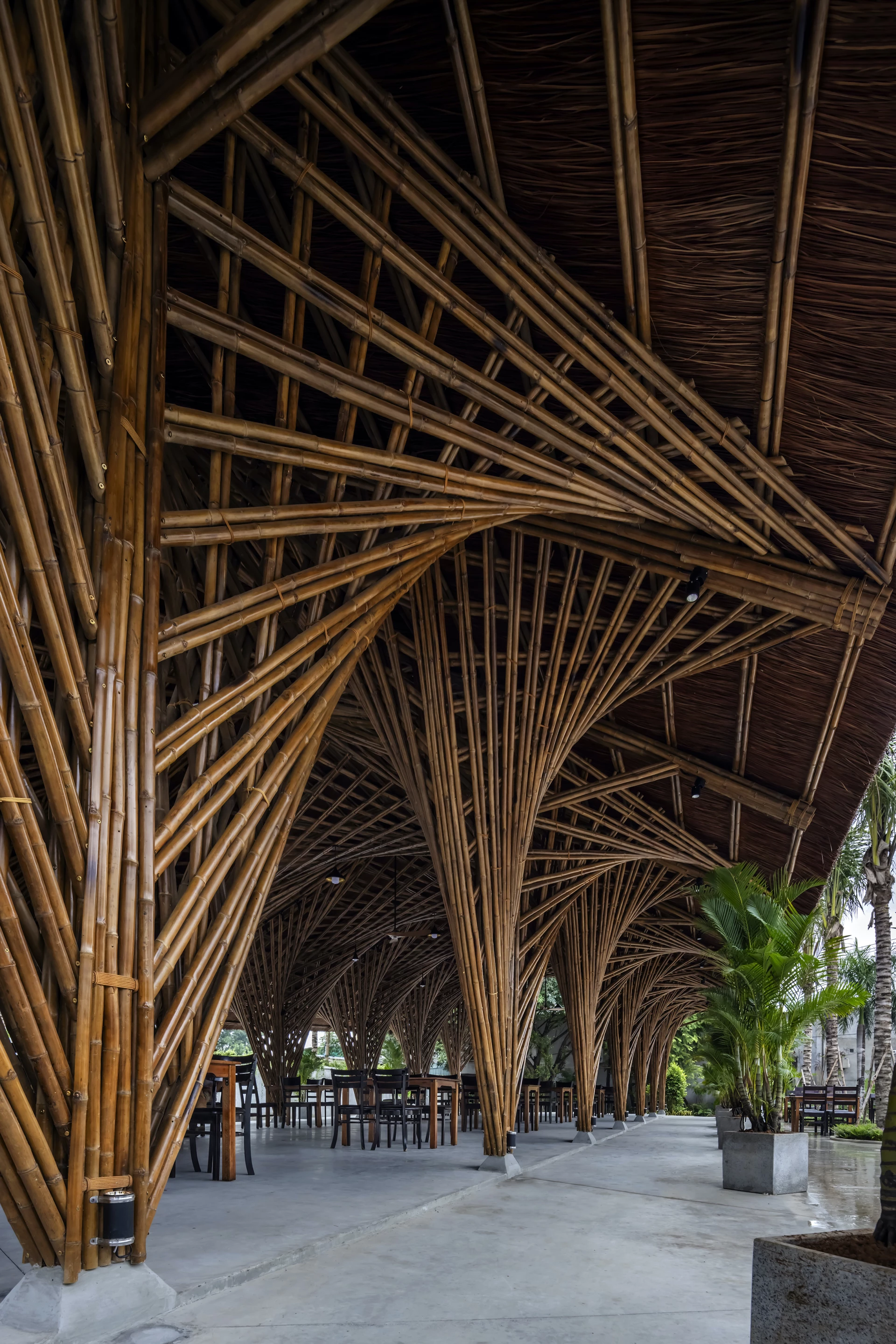 The Keeng Seafood Restaurant is made up of interlocking sections of bamboo, which are anchored with concrete foundations